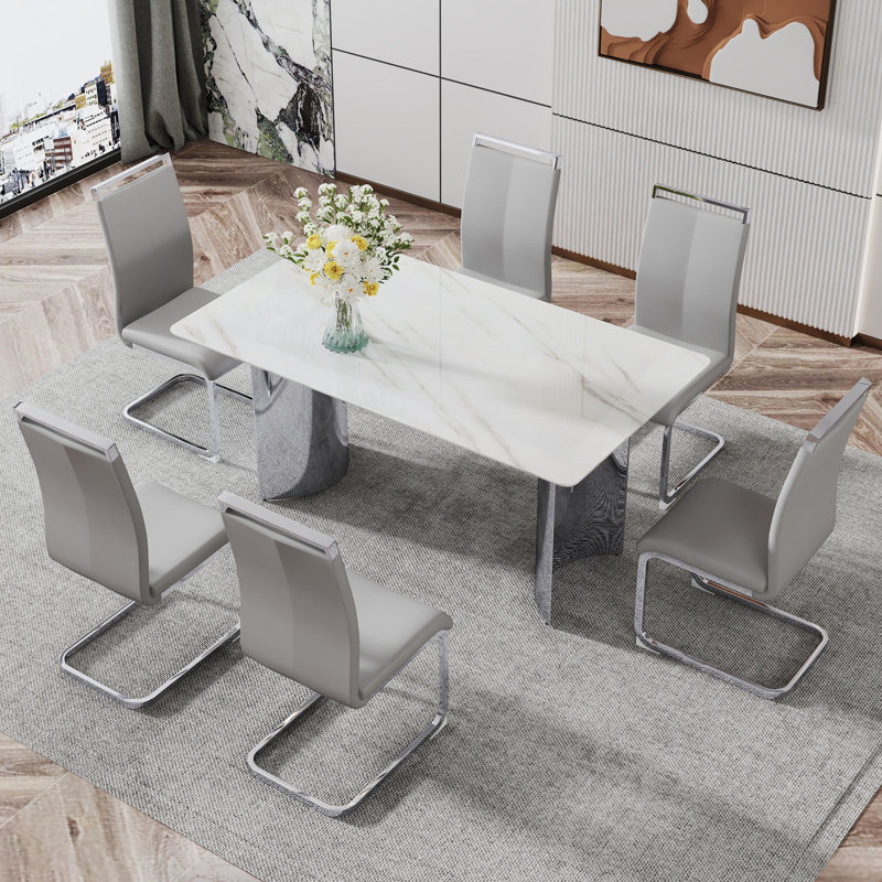 Table de salle à manger moderne et minimaliste. Bureau imitation verre imitation marbre, pieds en acier inoxydable, stable et magnifique. 6 sièges en polyuréthane de qualité supérieure.