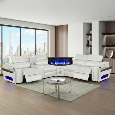 Canapé modulaire en L 4 blanc, revêtement en similicuir, structure en bois, siège mi-ferme, 2 appuis-tête réglables manuellement, coussin de recharge sans fil, ports, haut-parleur, barre éclairée à DEL, rangement pour accoudoirs 4