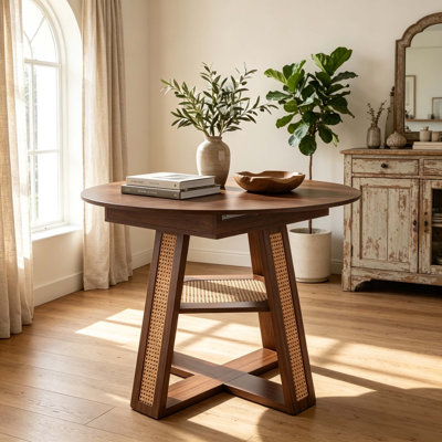 Table de salle à manger ronde extensible de 110 à 150 cm pour 4 à 6 personnes, table de cuisine ronde transformable en ovale avec rallonge amovible, piètement en croix et tablette de rangement, noyer