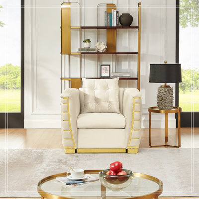 Fauteuil Brucker simple en velours capitonné avec coussins et pieds en métal