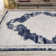 Amee Ornate Medallion Modern Ivory/Navy Rug