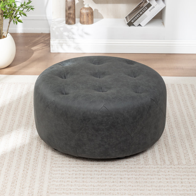 Castanedo Upholstered Round Ottoman, Polyester - Vintage Black