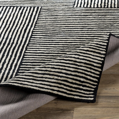 AllModern Balos Hand Tufted Black/Ivory Rug & Reviews | Wayfair