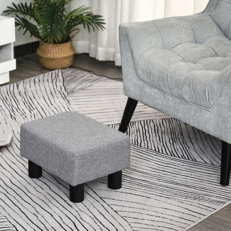 Repose-pieds en tissu de lin gris et pieds en plastique fiables pour un salon confortable