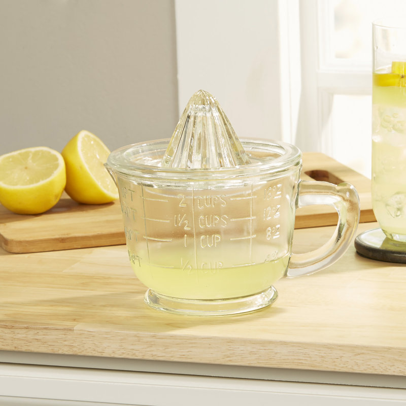 Presse-agrumes en verre pressé avec tasse à mesurer