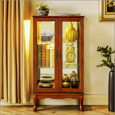 Vitrine lumineuse avec tablettes réglables, dossier en miroir et portes en verre trempé pour un rangement et une présentation élégants
