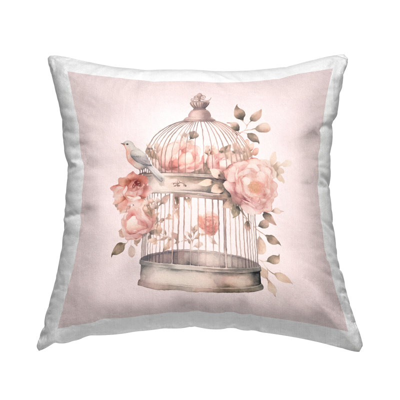 Coussin décoratif avec cage à oiseaux et fleurs roses, design par Andrea Haase