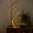 Nova 24 in. Double Hoop Novelty LED Halo Industrial Arched Gold Brass Table Lamp with Built-In 3-Way Dimmer