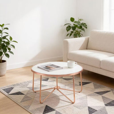 Table basse ronde minimaliste et moderne avec plateau en verre blanc dépoli et piètement en métal doré rose