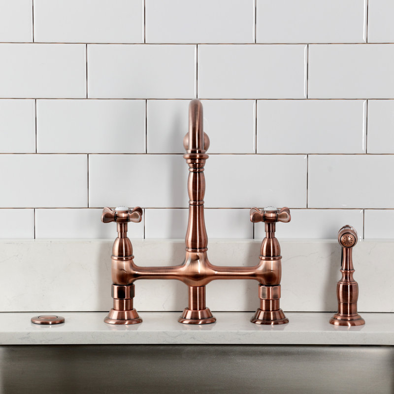 Kingston Brass Bel-Air Two-Handle 4-Hole Deck Mount Bridge Kitchen Faucet with Brass Side Sprayer, Cross, Antique Copper