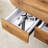 Coffee Table With Double Drawers. The Board Surface Is MDF Sticker, And Both Sides Are Transparent Tempered Glass. The Design Is Simple And Elegant, With Excellent Storage Functions.