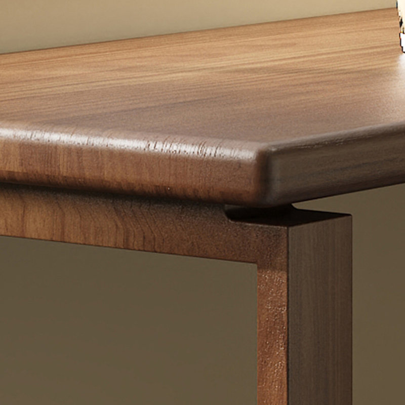 A simple rectangular solid wood desk in walnut color, 29.53" H x 62.99" W x 23.62" D