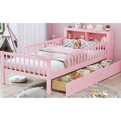 Superbe lit simple rose avec garde-corps robustes et espace de rangement pour la tête de lit