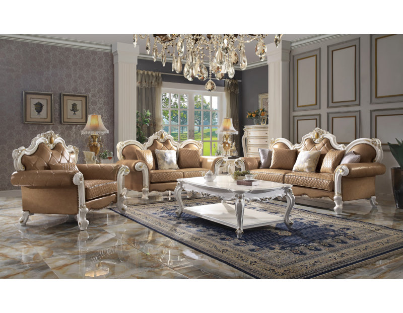  Fauteuil capitonné beige en similicuir avec coussin décoratif
