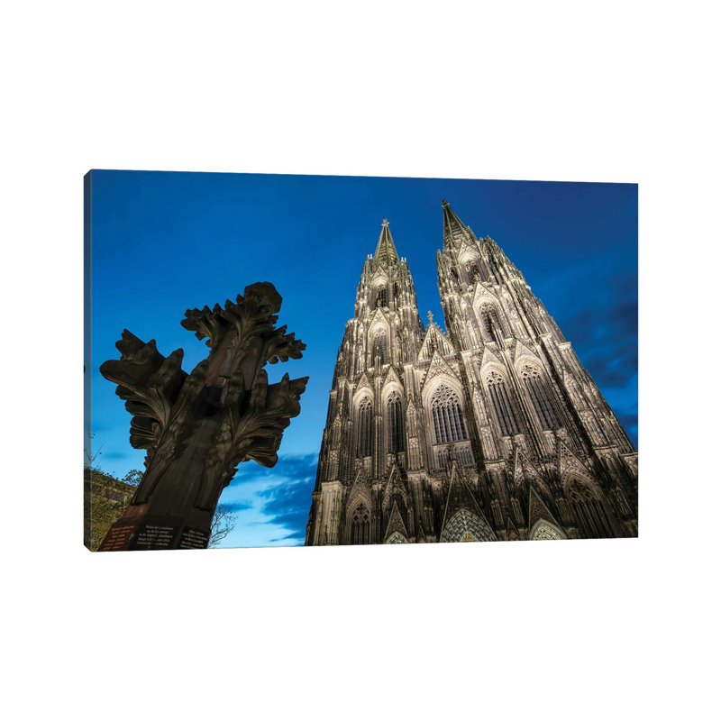Kreuzblume In Front Of The Cologne Cathedral, North Rhine-Westphalia, Germany by Jan Becke - Wrapped Canvas Print