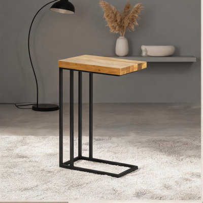 Rectangular solid oak side table with black-toned metal sled base for sofa-arm use in living rooms