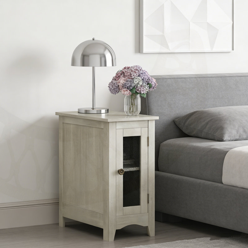 Table d'appoint rectangulaire étroite avec armoire de rangement et porte grillagée en métal pour une polyvalence compacte.