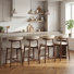 Tabouret de comptoir rembourré Vannie avec structure en bois massif