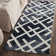 Bryauna Hand Tufted Wool/Cotton Geometric Rug in Graphite/Ivory