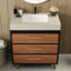 Meuble-lavabo moderne avec lavabo vasque en céramique intégré, comptoir en pierre frittée et système de tiroir à fermeture en douceur pour un rangement soigné.
