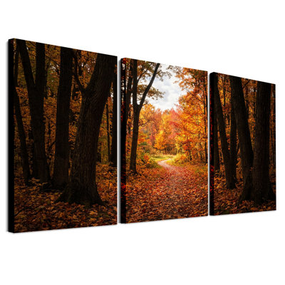 Ensemble de 3 toiles murales « Chemin à travers la forêt avec des feuilles d'automne orangées »