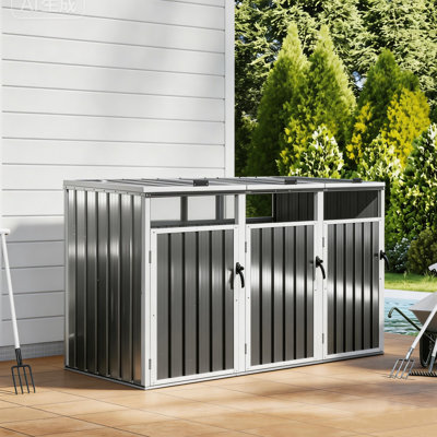 Outdoor trash can storage shed with a lockable door and a hinged lid, designed to hold three trash cans (standard 50-gallon or 45-gallon)