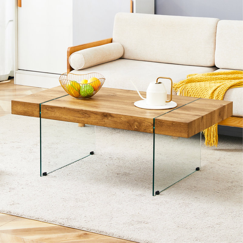 Table basse 43,3 po x 23,6 po en bois aggloméré texturé avec pieds en verre trempé. Convient au salon. Elle peut être utilisée non seulement comme table basse, mais aussi comme table d'appoint ou présentoir.