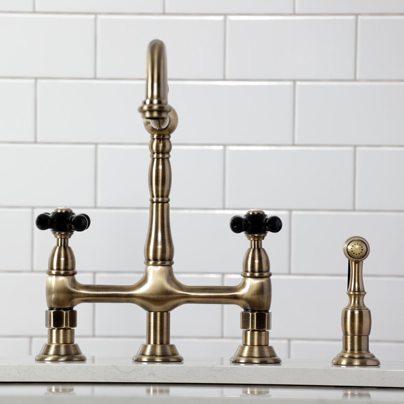 Kingston Brass Duchess Two-Handle 4-Hole Deck Mount Bridge Kitchen Faucet with Brass Side Sprayer, Antique Brass