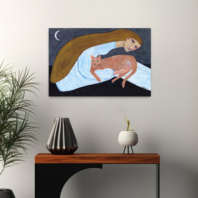 Amoureux des chats assis sous les étoiles et la lune