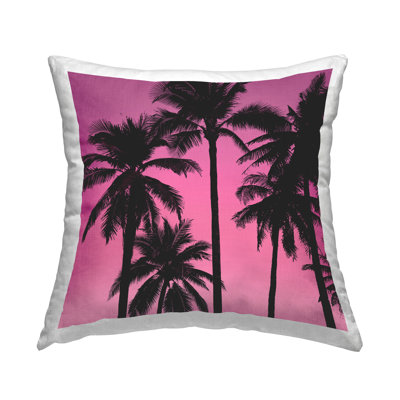 Coussin rose avec motif de palmiers Sunrise par Mia Jensen