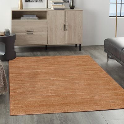 Nourison Essentials Rust Area Rug