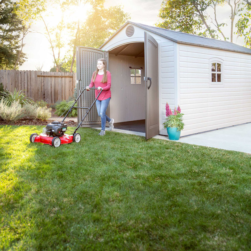 Large Beige and Brown Polyethylene Storage Shed with Windows and Shelving