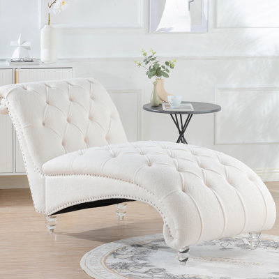 Chaise longue sans accoudoirs avec une large assise stable, un rembourrage en éponge et un taux de rebond élevé, un processus d'emboutissage profond, des clous à bulles décoratifs, trois options de tissus - velours, velours PU, solide