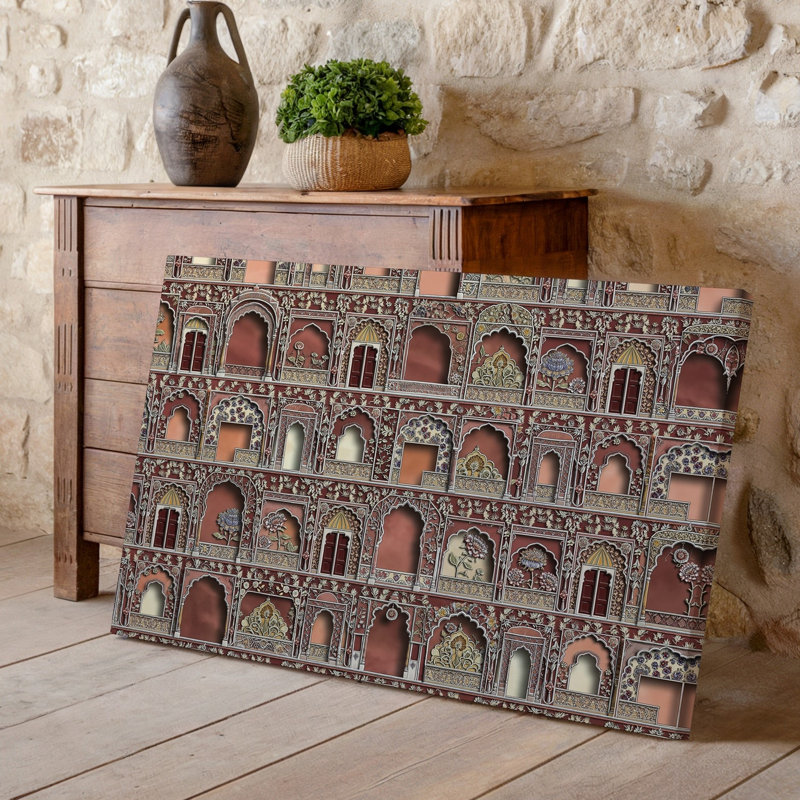 La toile crée un design de tissu richement texturé mettant en vedette un collage d'art mural aux motifs architecturaux indiens complexes, y compris un art mural sur toile arquée