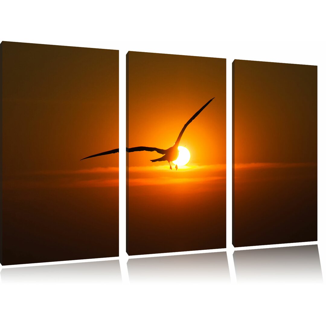 3-tlg. Leinwandbild-Set „Möwe fliegt in den Sonnenuntergang“, Grafikdruck