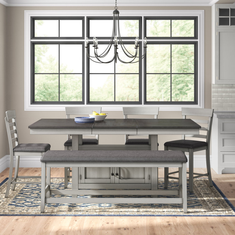 Knauss - Person Extendable Four Leg Dining Set