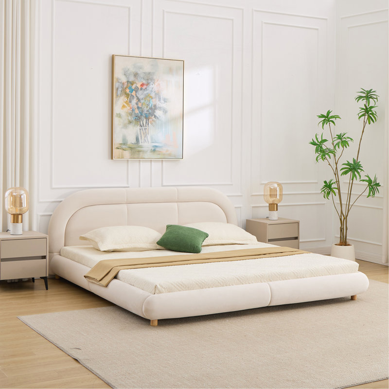 Très grand lit plateforme tapissier à profil bas avec tête de lit arrondie, Beige