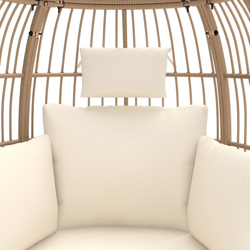 Fauteuil ovale rembourré en osier avec repose-pieds