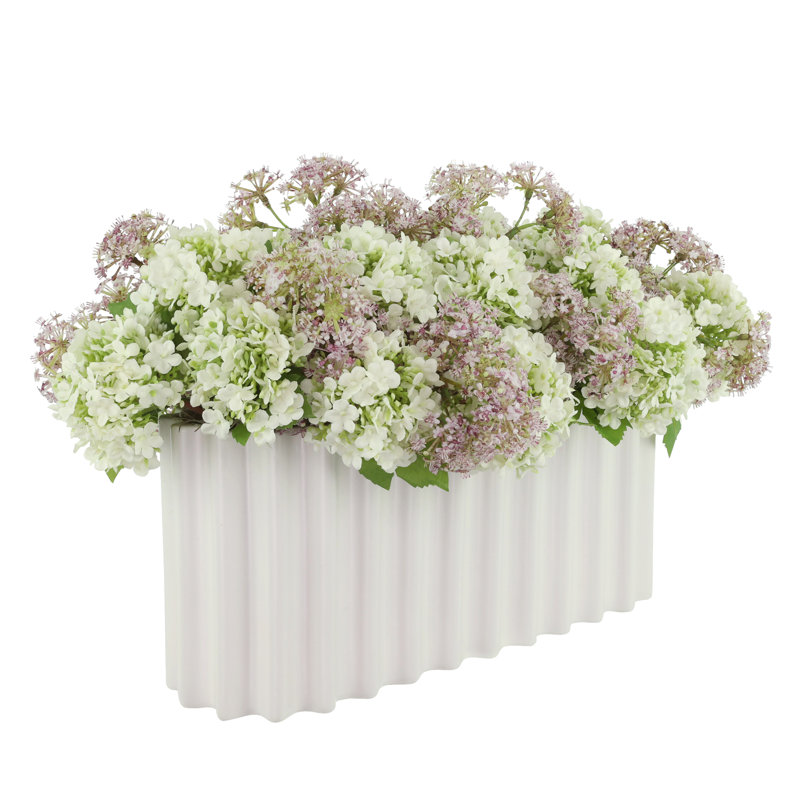 Viburnum and Weeping Laurel Arranged in a Ceramic Vase