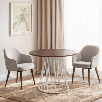Table de salle à manger ronde avec piètement en acier et dessus en bois, quatre couverts, hauteur fixe.