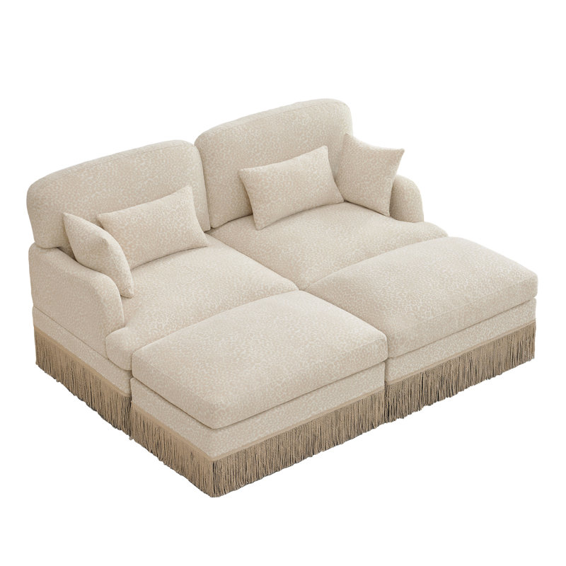 Canapé en chenille à imprimé léopard avec bordure à pampilles, siège profond ergonomique, repose-pieds modulaires et assemblage sans effort pour les espaces de vie modernes.