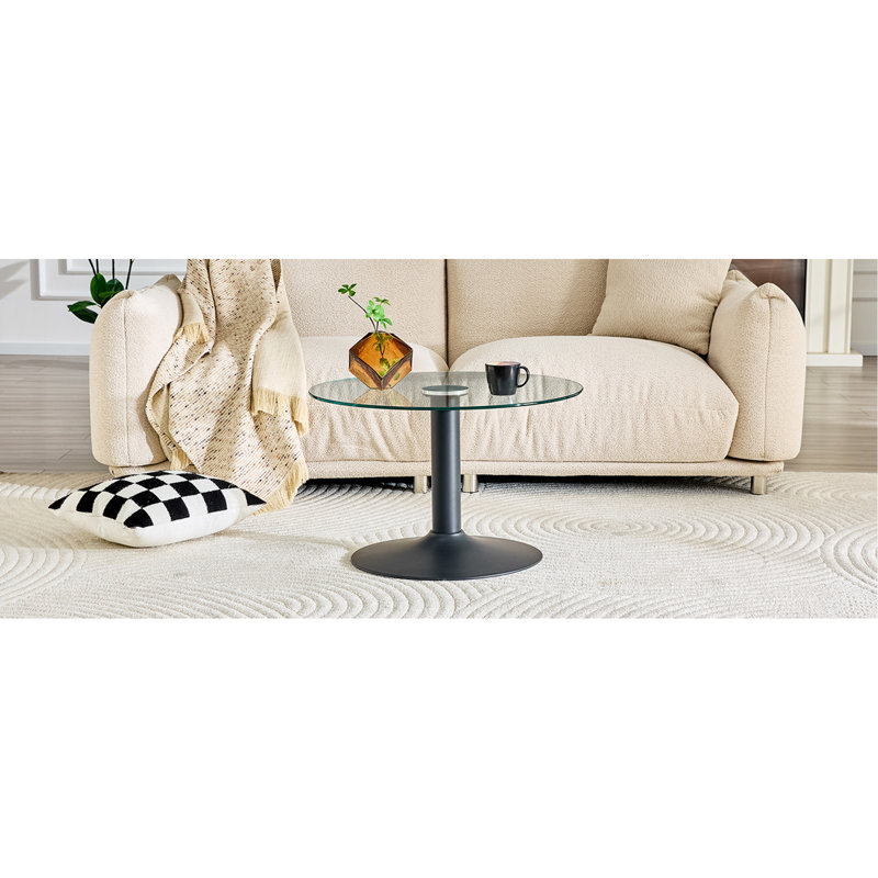 Table basse ronde en verre trempé de 27,5 pouces de diamètre. 17,7 pouces de haut, soutenu par une base en métal noir, avec un bord de luxe léger.