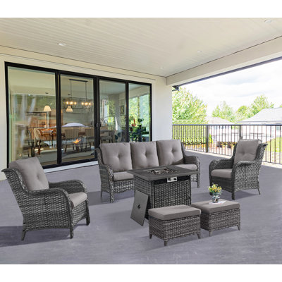 Ensemble de conversation d'extérieur en osier pour 5 personnes avec foyer, canapé, chaises, repose-pieds et coussins Schutt