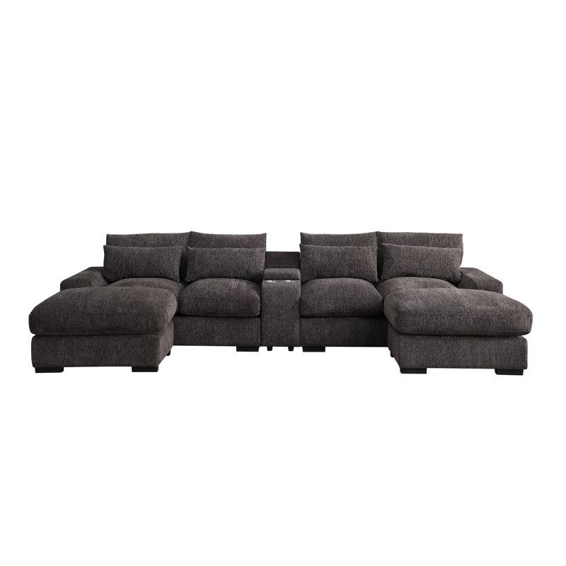 En forme de U avec 4 sièges, dossier à coussin mi-ferme, accoudoirs carrés, flanelle café, deux repose-pieds, console porte-gobelets et siège modulaire à 4 ports de charge, habillage en flanelle, encastré
