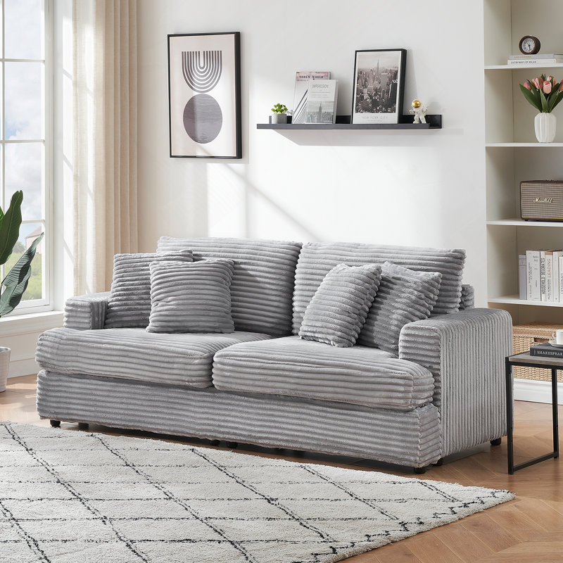 Spacious and Comfortable 3 - Seater Sofa with Four Throw Pillows, Ideal for Relaxing and Entertaining in a Modern Living Room