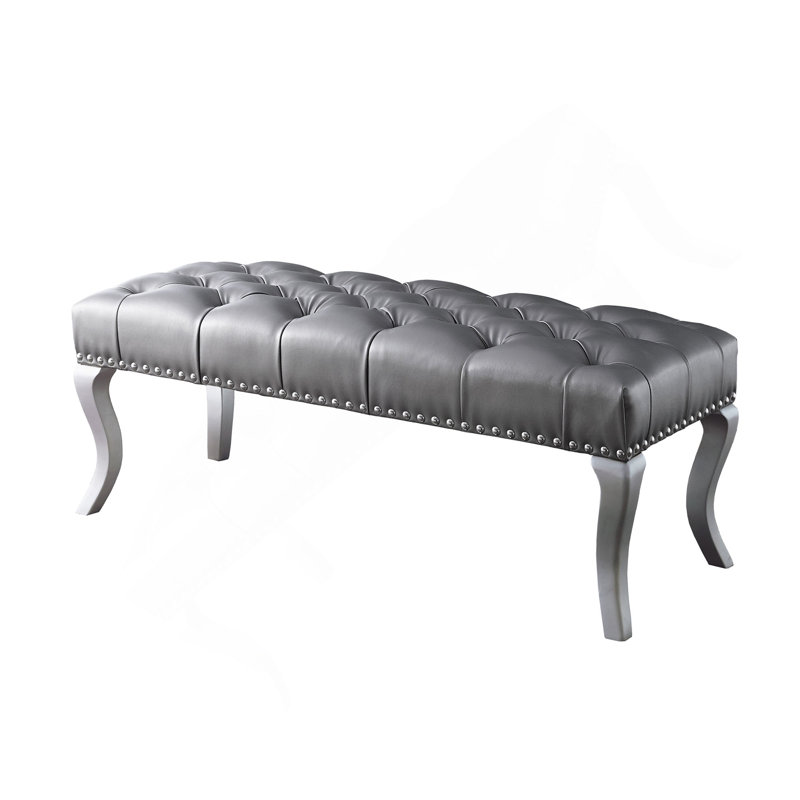 Banc capitonné en tissu avec garniture cloutée