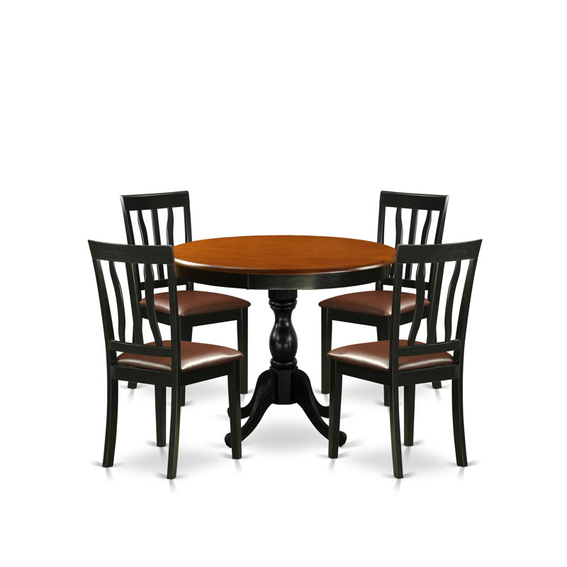 L'ensemble de table de salle à manger 5 pièces se compose d'une table et de 4 chaises de cuisine en similicuir avec dossier à lattes - finition noire
