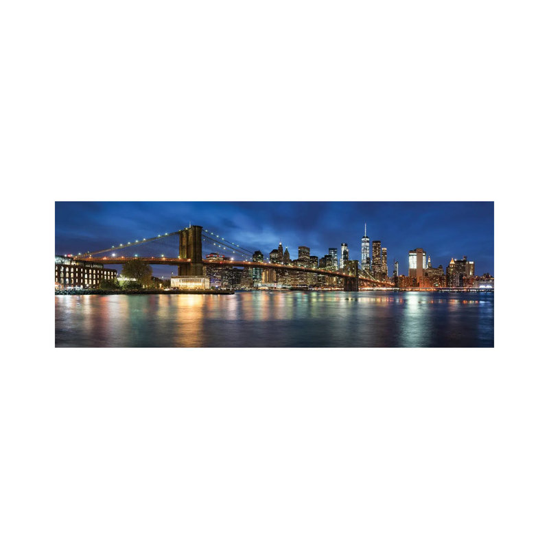 Manhattan Skyline Panorama With Brooklyn Bridge At Night by Jan Becke - Wrapped Canvas Panoramic Print