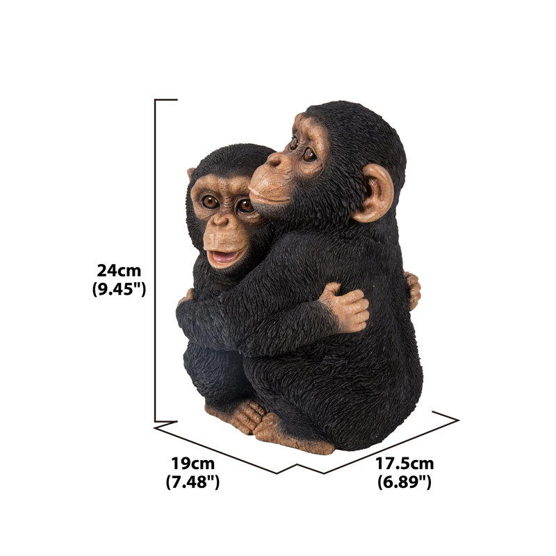 Chimpanzees Hugging Statue