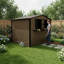Remise de rangement extérieure en métal de 6 pi x 9 pi avec fenêtre et support à fleurs, remise à outils verrouillable à deux portes, remise de jardin imperméable et résistante aux intempéries pour patio de jardin brun noir